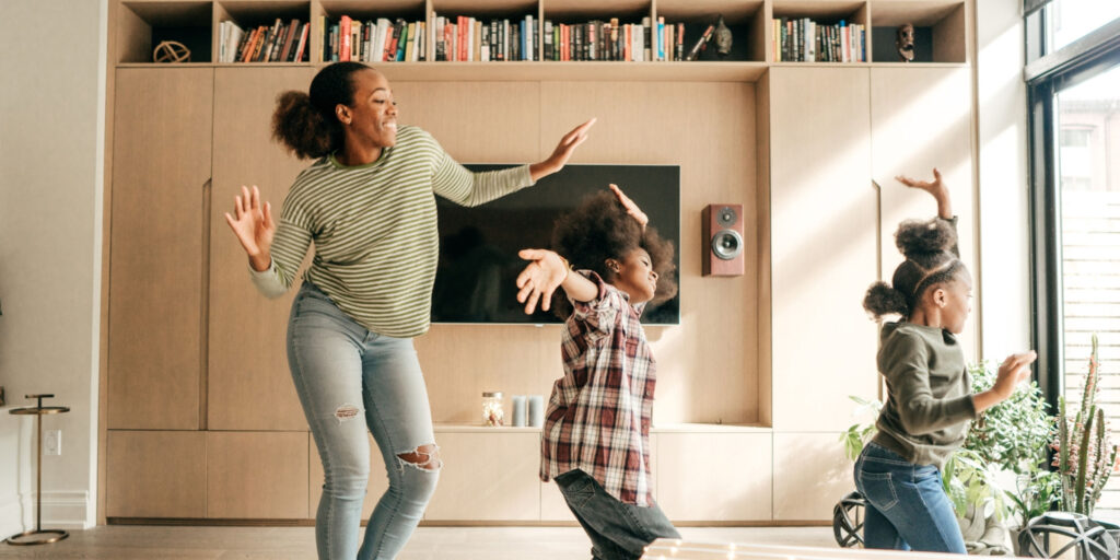 Mom dancing with daughters